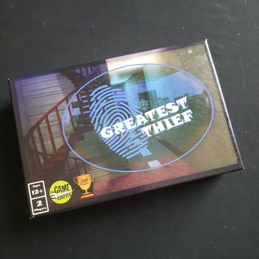 Image shows the front cover of the box of the Greatest Thief board game