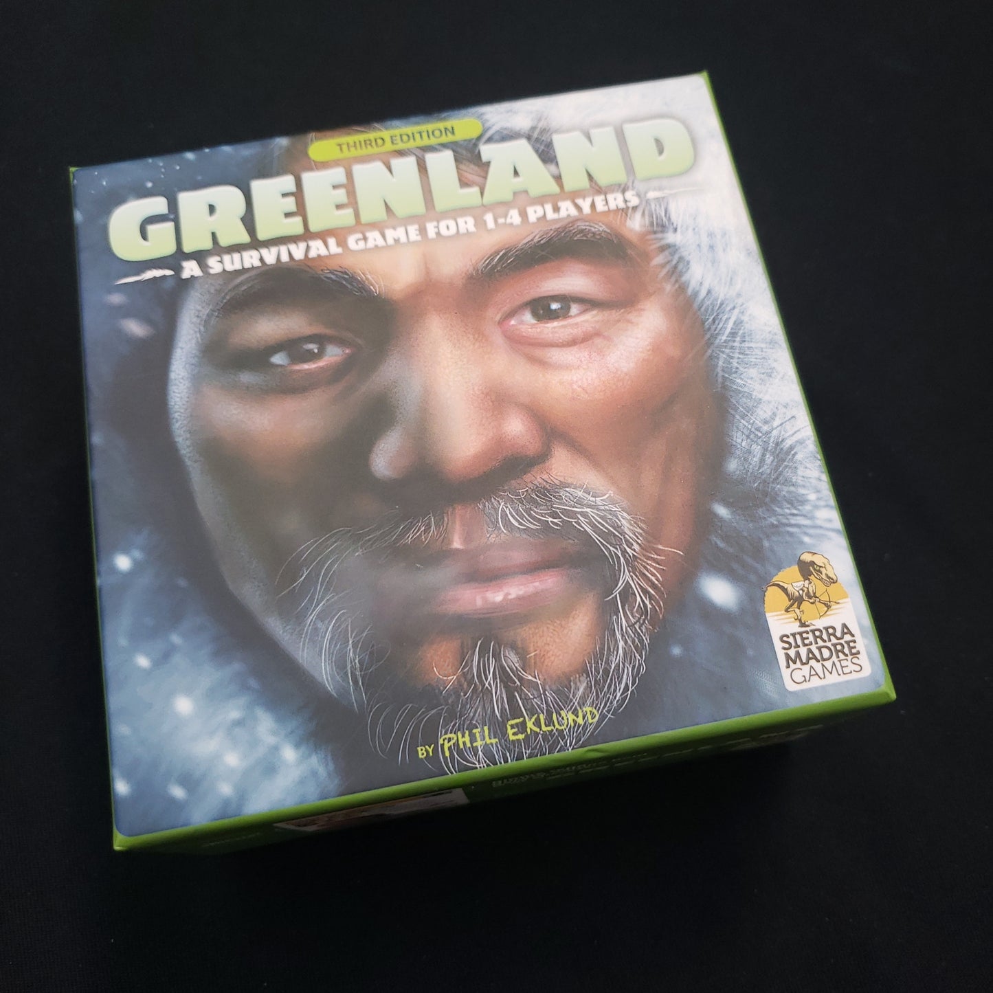Image shows the front cover of the box of the Greenland board game