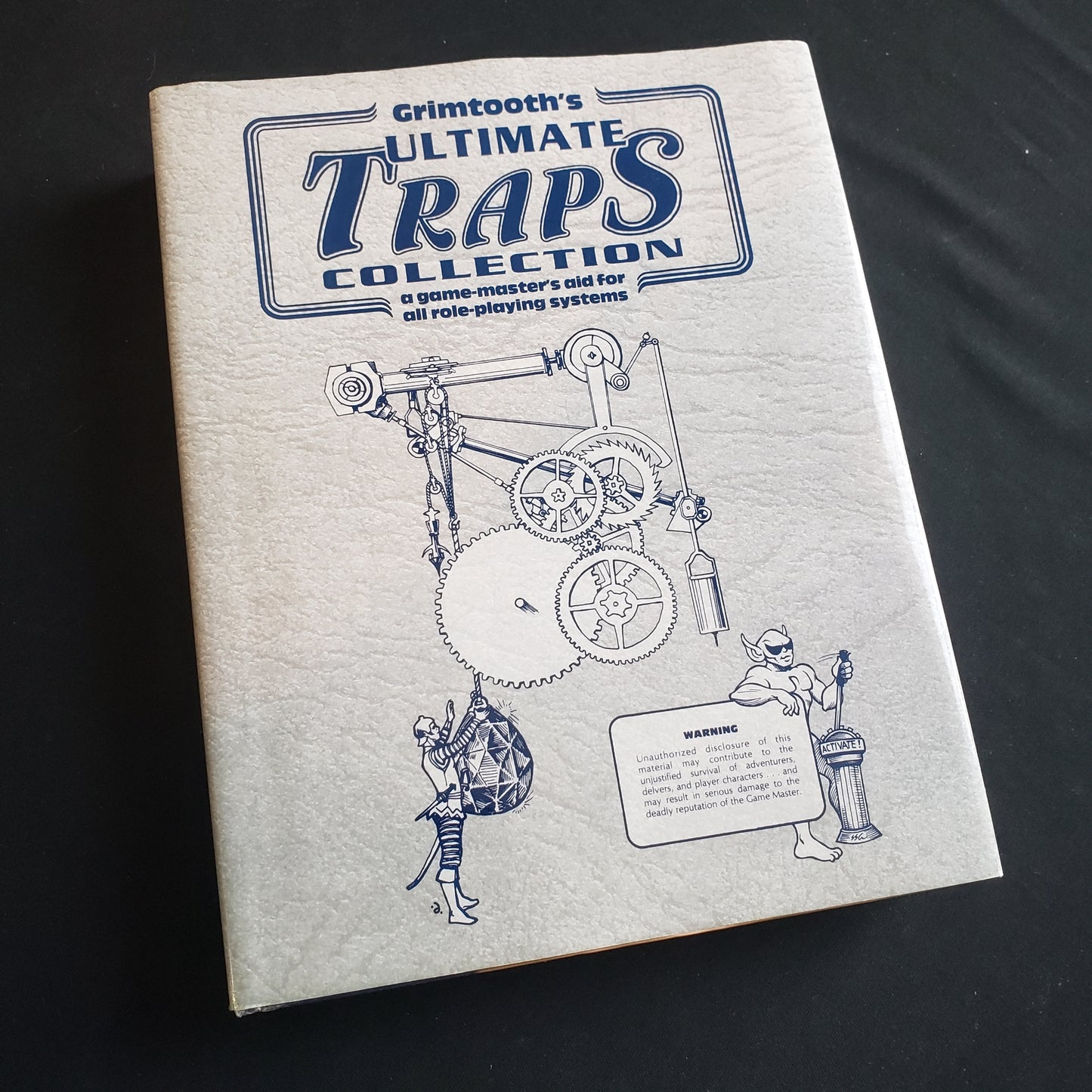 Image shows the front cover of the Grimtooth's Ultimate Traps Collection roleplaying game book