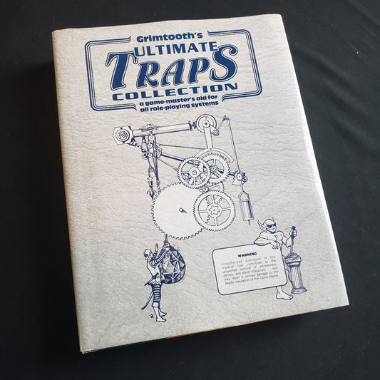 Image shows the front cover of the Grimtooth's Ultimate Traps Collection roleplaying game book