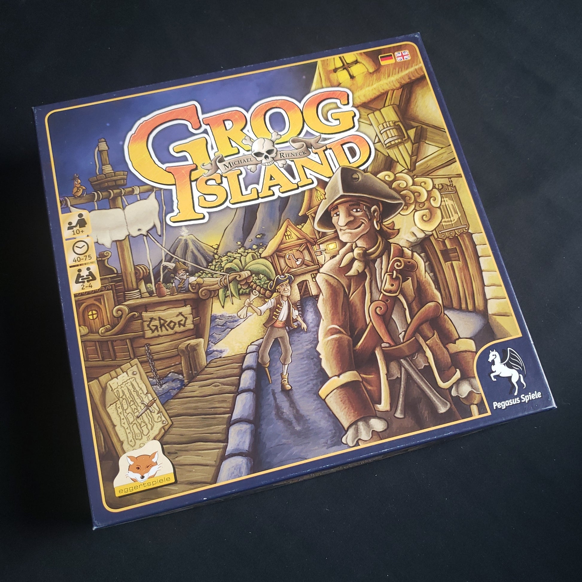 Image shows the front cover of the box of the Grog Island board game