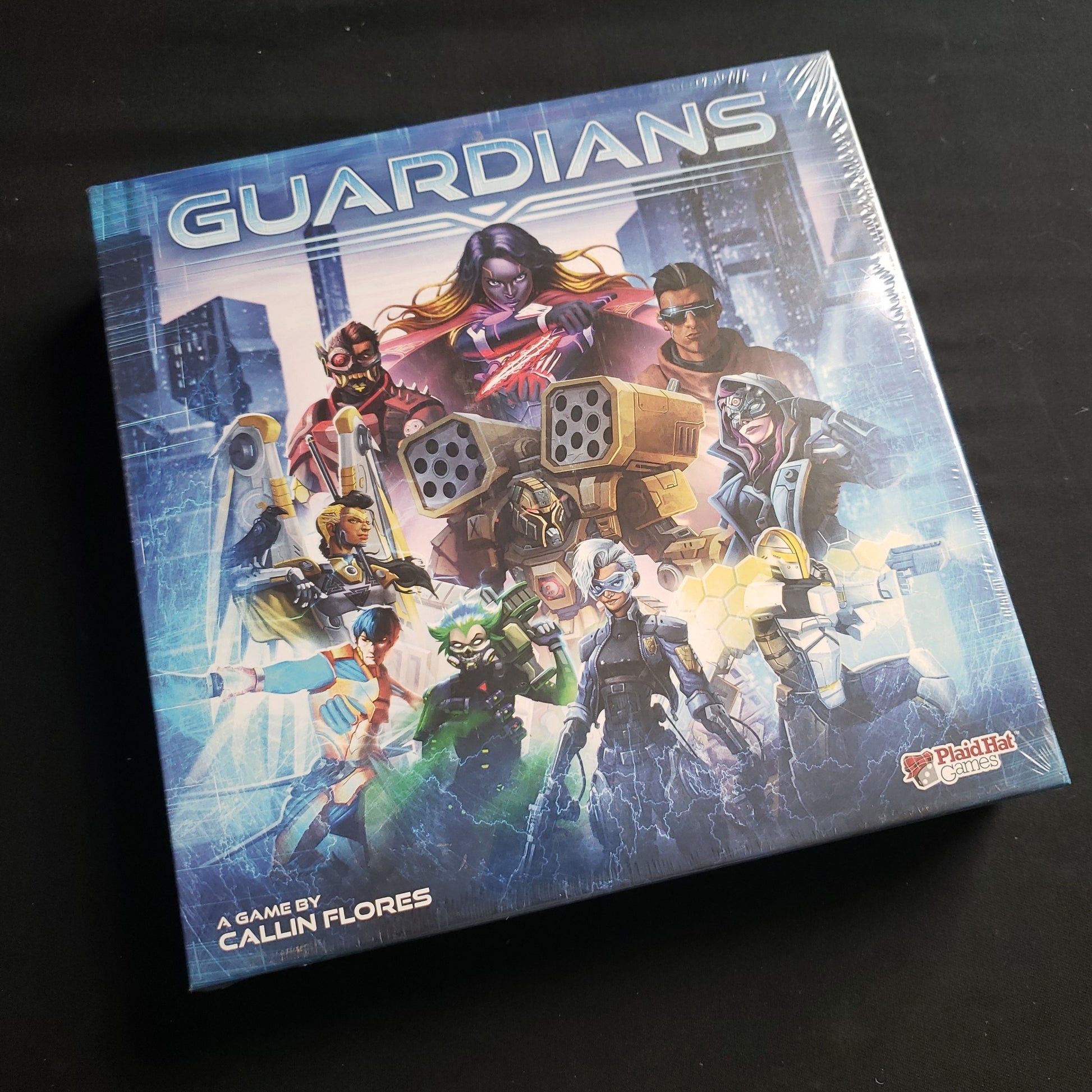 Image shows the front cover of the box of the Guardians card game