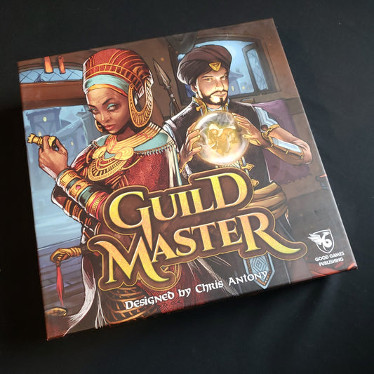Image shows the front cover of the box of the Guild Master board game