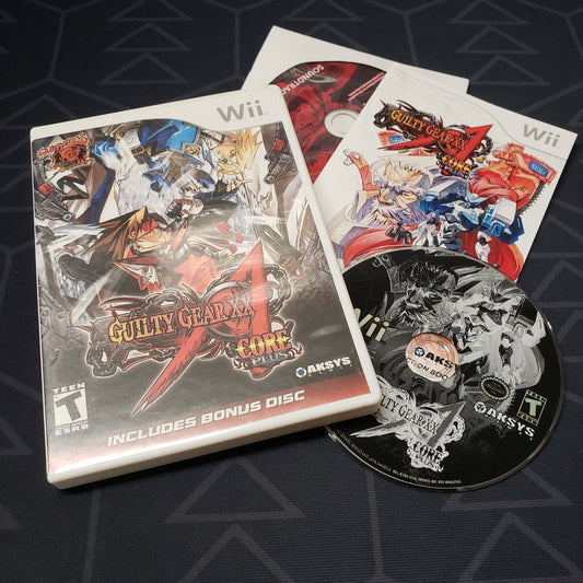 Image shows the case, manual, soundtrack CD and game disc for the video game Guilty Gear XX Accent Core Plus for Nintendo Wii