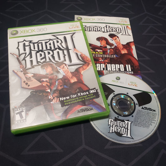 Image shows the case, manual and disc for the video game Guitar Hero II for Xbox 360