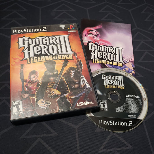Image shows the case, manual and disc for the video game Guitar Hero III: Legends of Rock for Playstation 2