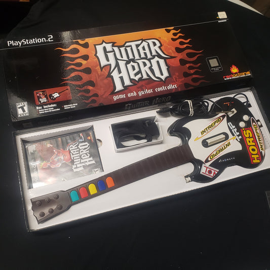 Image shows the box and components of the SG Guitar Bundle for the video game Guitar Hero for Playstation 2