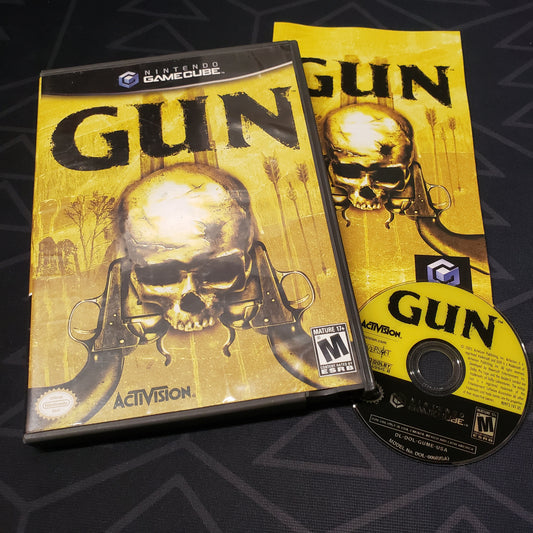 Image shows the case, manual and disc for the video game Gun for Nintendo GameCube