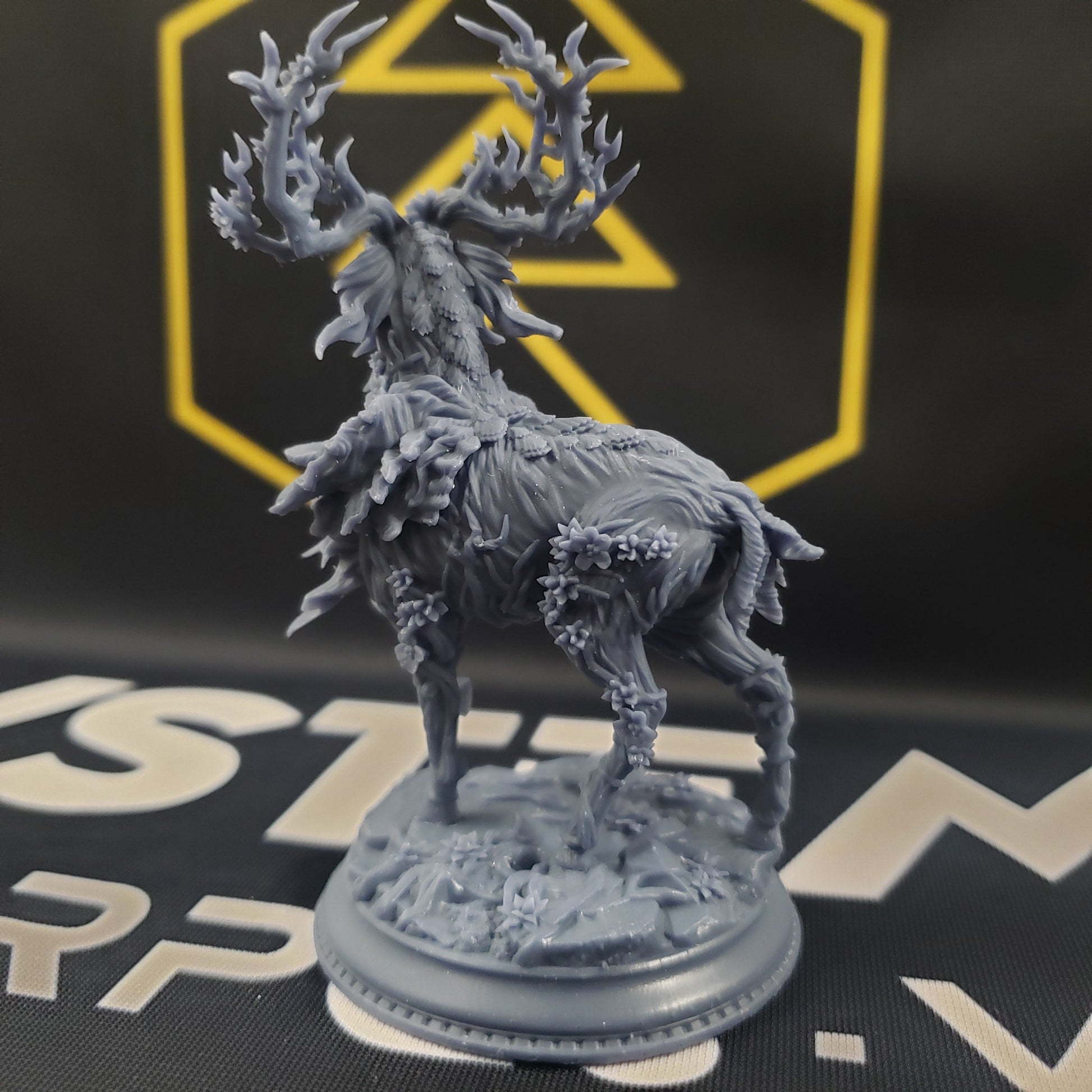 Image shows the back of a fey deer gaming miniature.