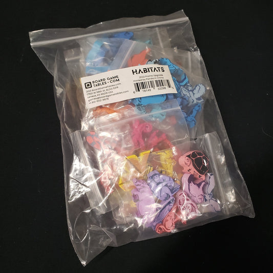 Image shows the packaging of the upgraded components for the board game Habitats