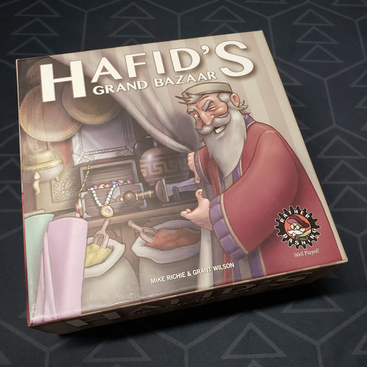 Image shows the front cover of the box for the Hafid's Grand Bazaar board game
