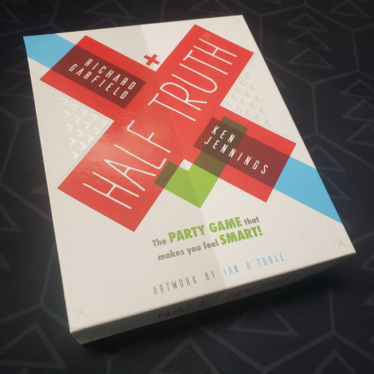 Image shows the front cover of the box for the Half Truth party game
