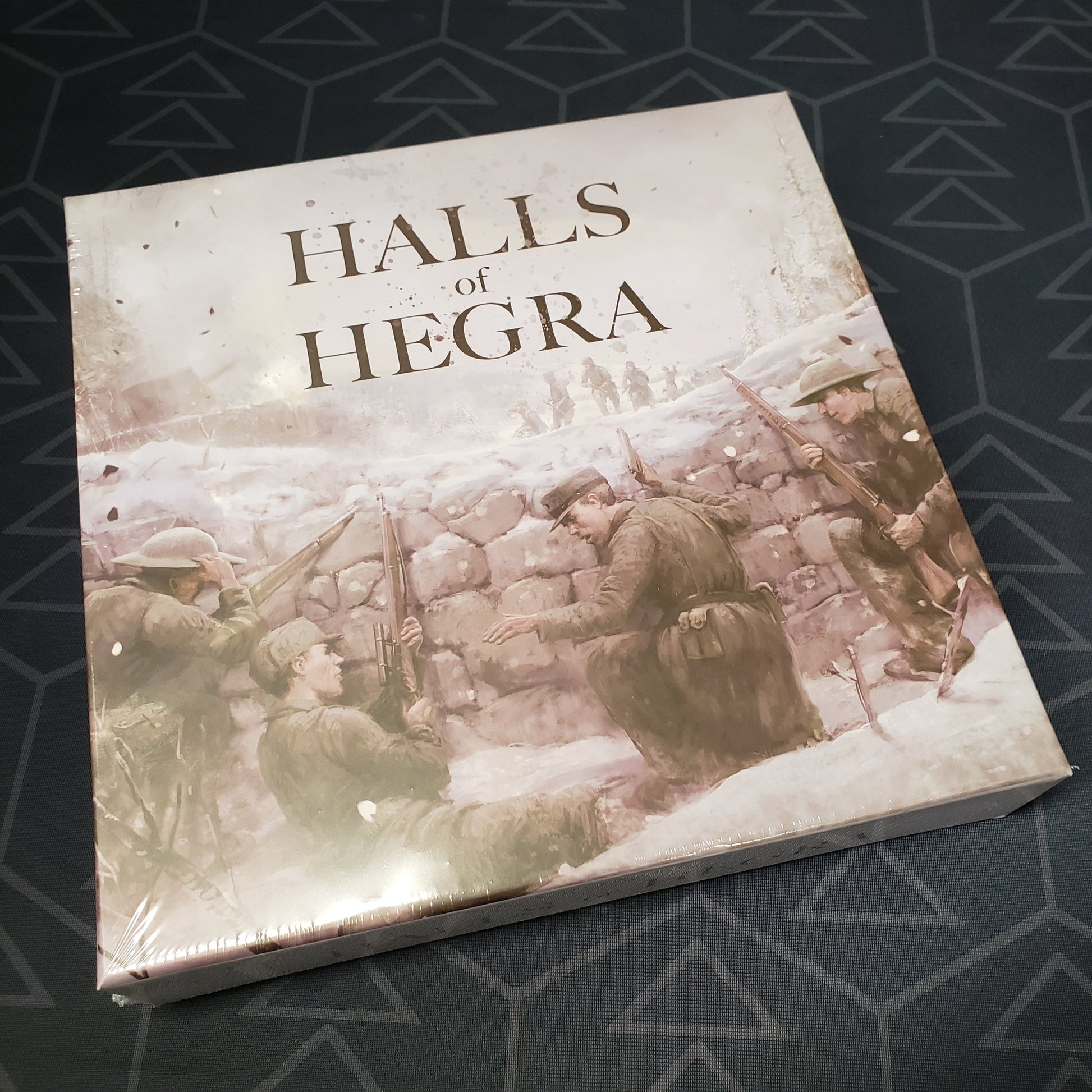 Image shows the front cover of the box of the Halls of Hegra board game