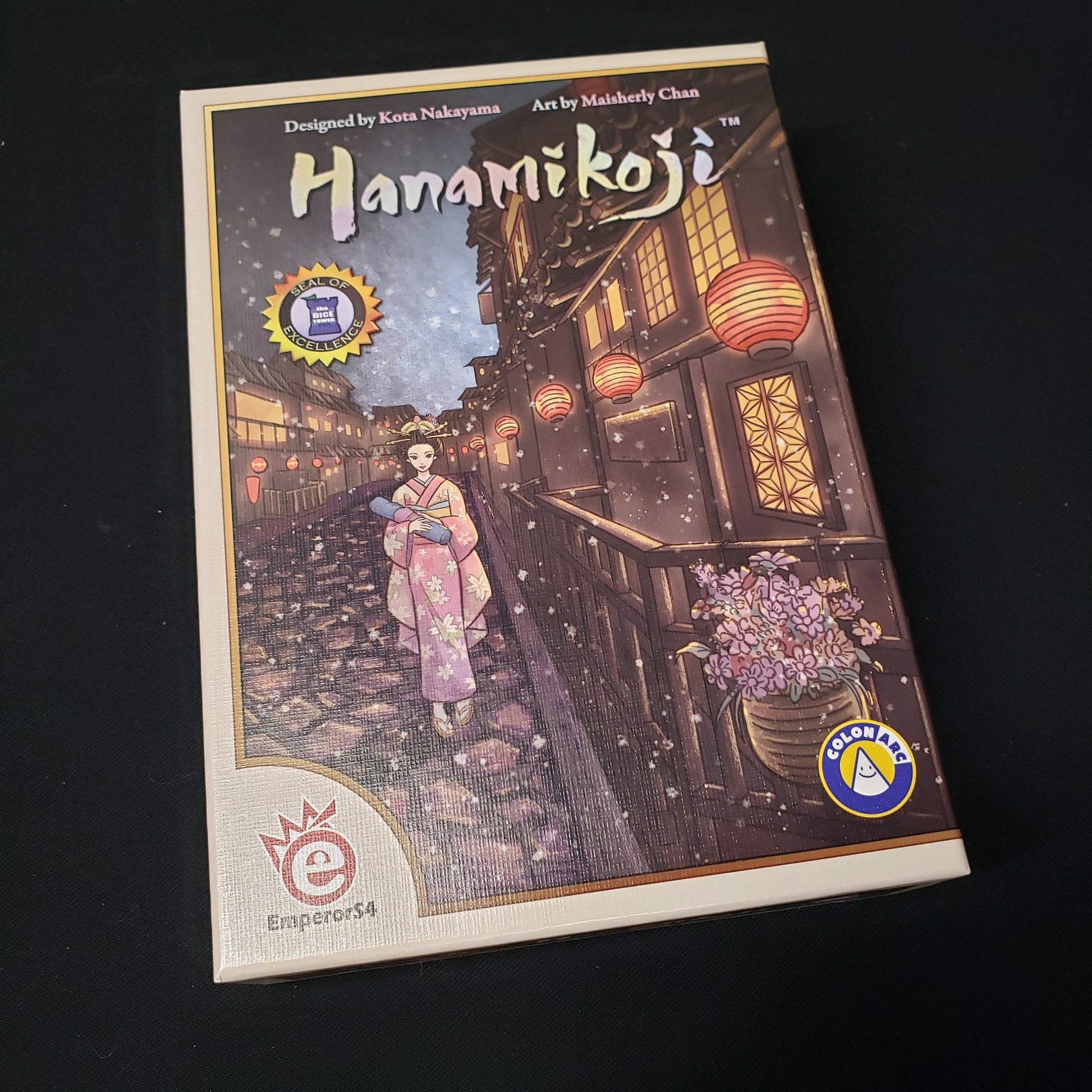 Image shows the front cover of the box of the Hanamikoji card game