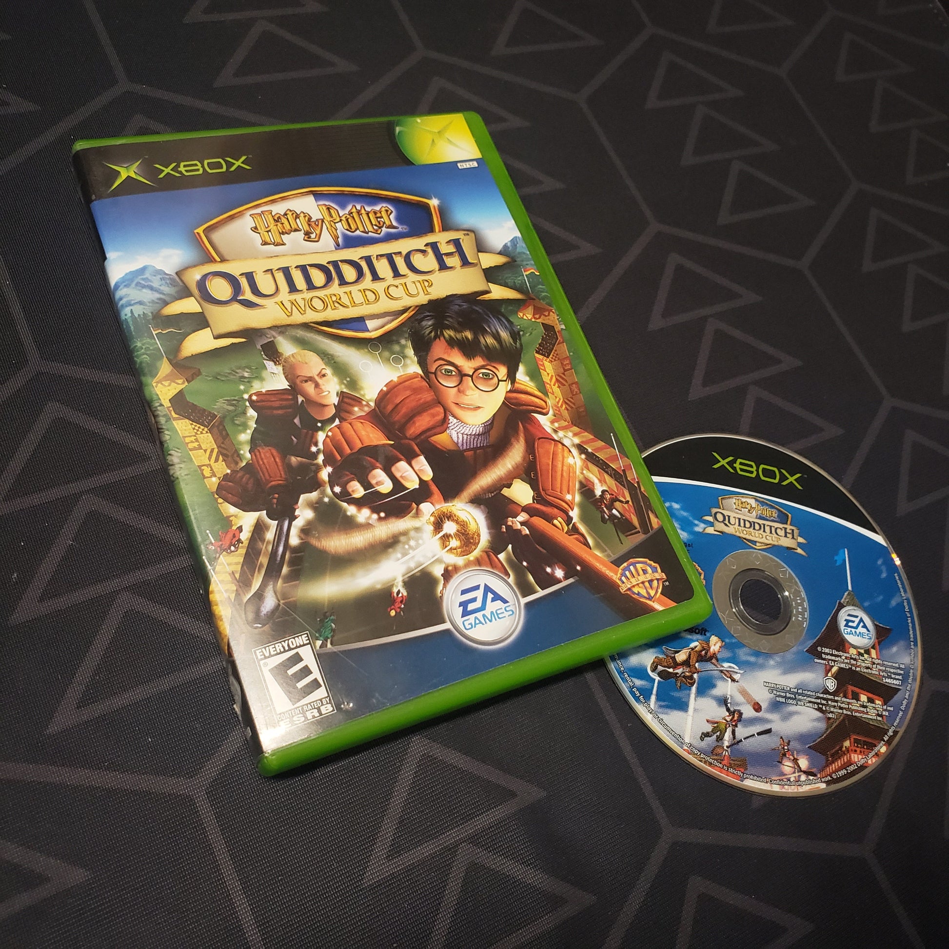 Image shows the case and disc for the video game Harry Potter: Quidditch World Cup for the original Xbox
