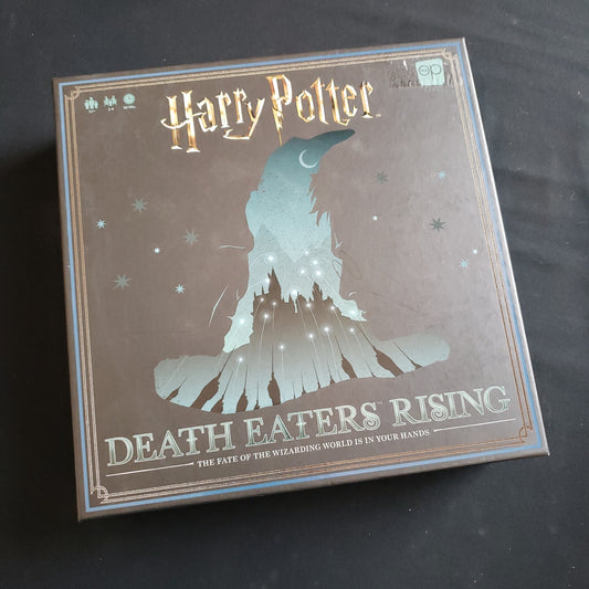 Image shows the front cover of the box of the Harry Potter: Death Eaters Rising board game