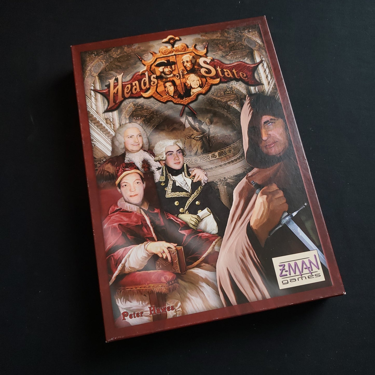 Image shows the front cover of the box of the Heads Of State board game