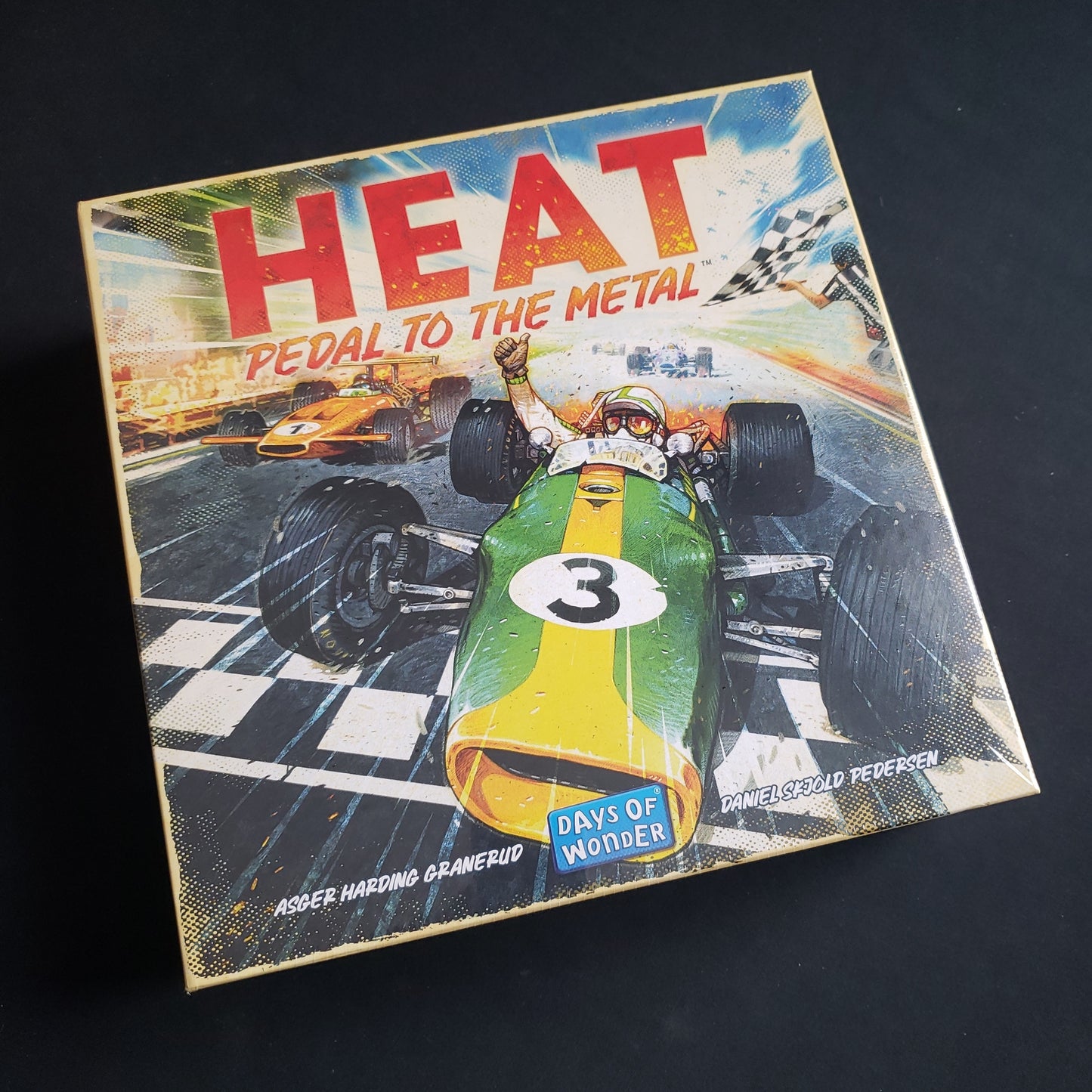 Image shows the front cover of the box of the Heat: Pedal to the Metal board game