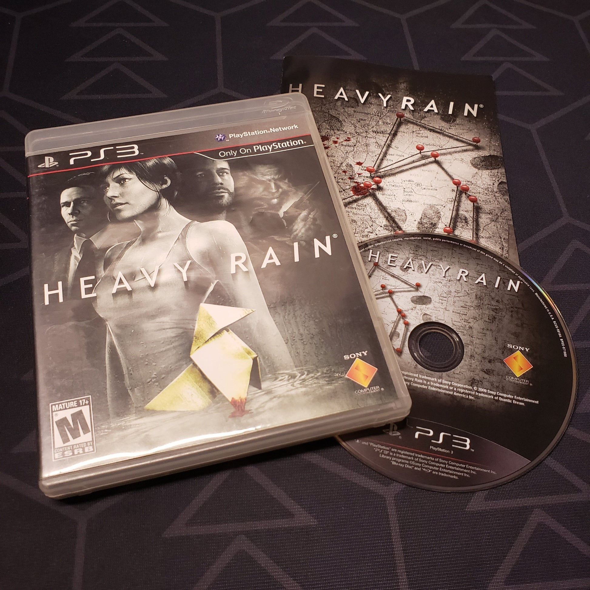 Image shows the case, manual and disc for the video game Heavy Rain for Playstation 3