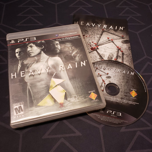 Image shows the case, manual and disc for the video game Heavy Rain for Playstation 3