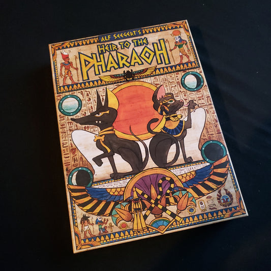 Image shows the front cover of the box of the Heir to the Pharaoh board game