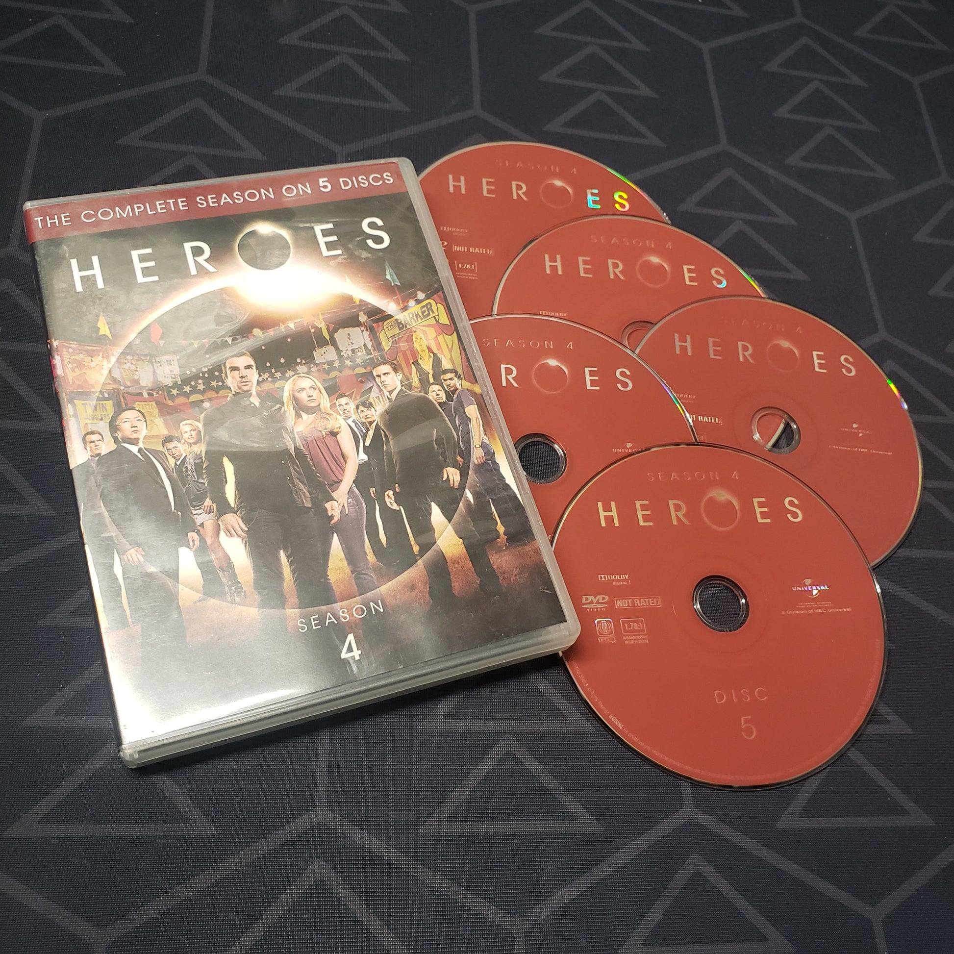 Image shows the case & five discs for the fourth season of Heroes on DVD