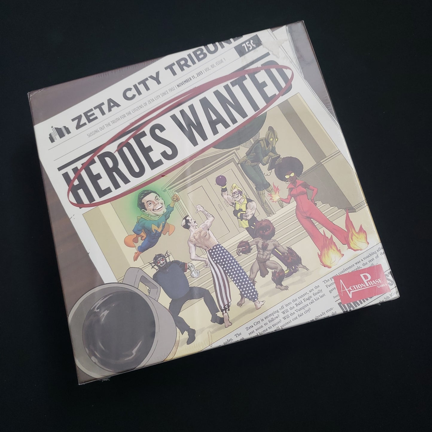 Image shows the front cover of the box of the Heroes Wanted board game