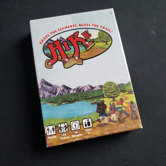 Image shows the front cover of the box of the Hike card game