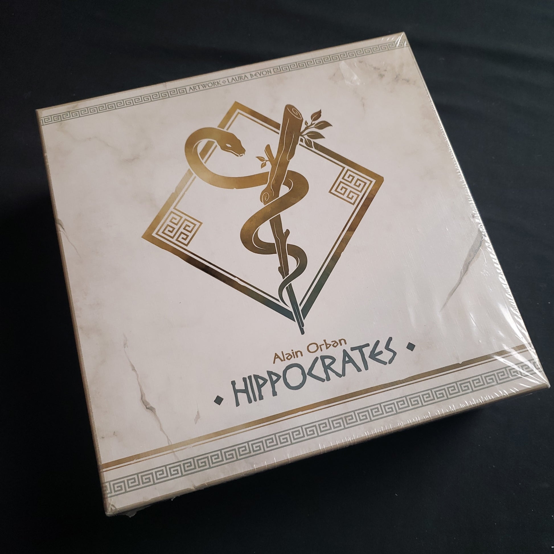 Image shows the front cover of the box of the Hippocrates board game