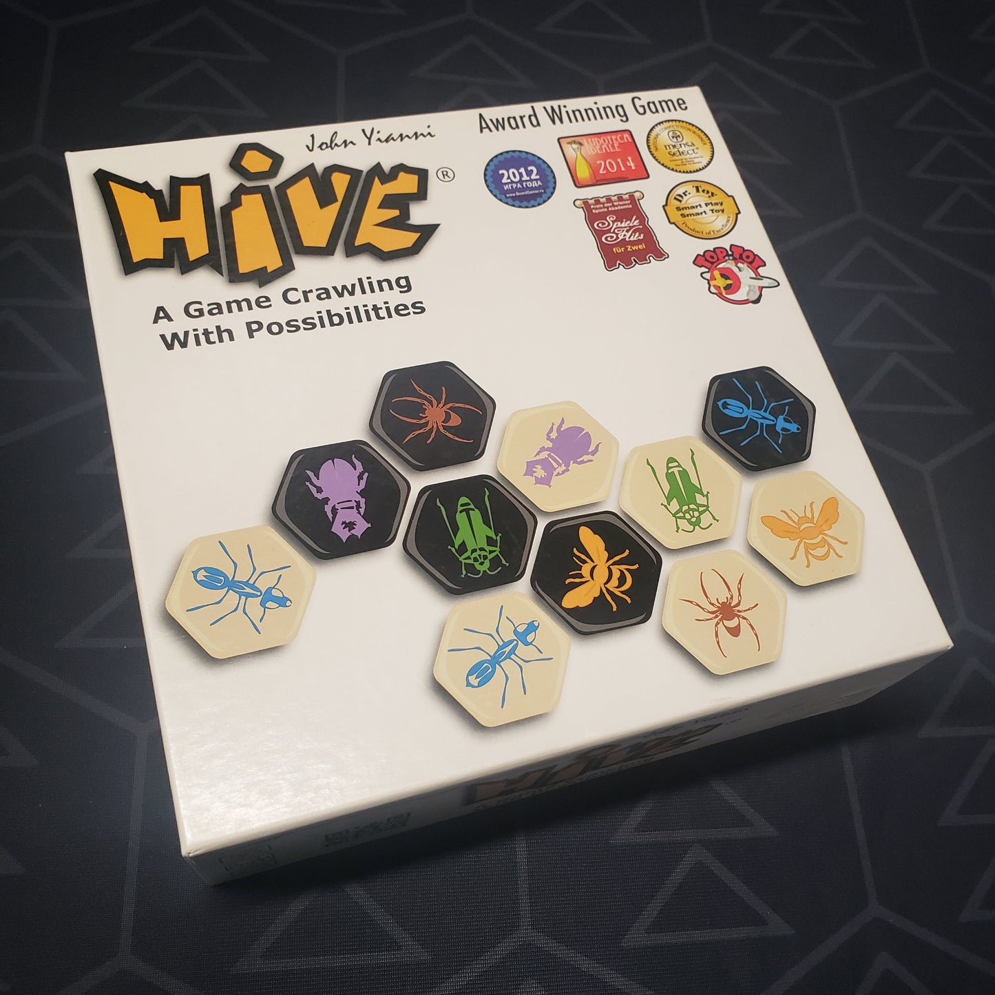 Image shows the front cover of the box for the Hive board game