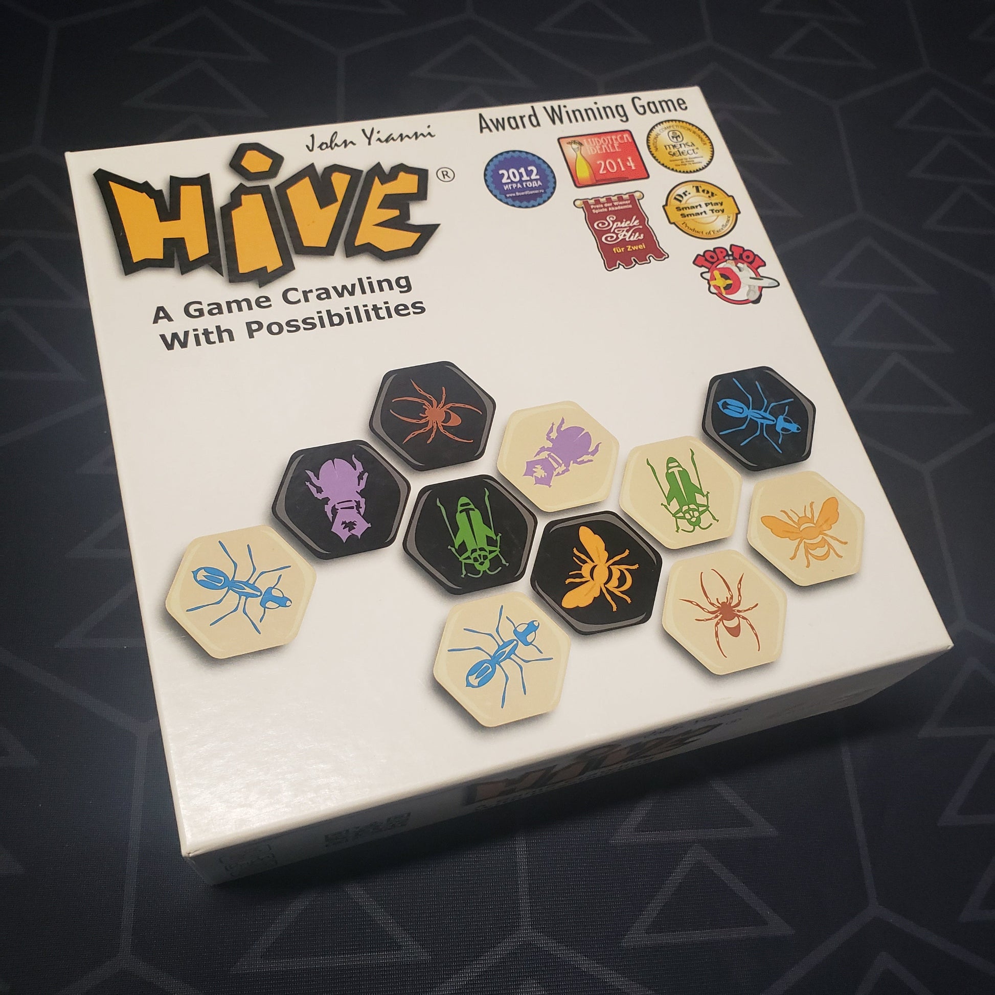 Image shows the front cover of the box for the Hive board game