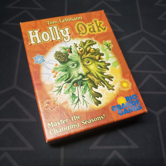 Image shows the front cover of the box for the Holly Oak card game