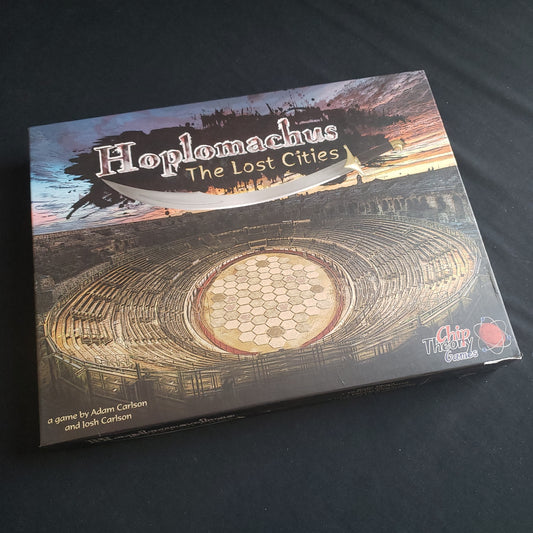 Image shows the front cover of the box of the Hoplomachus: The Lost Cities board game