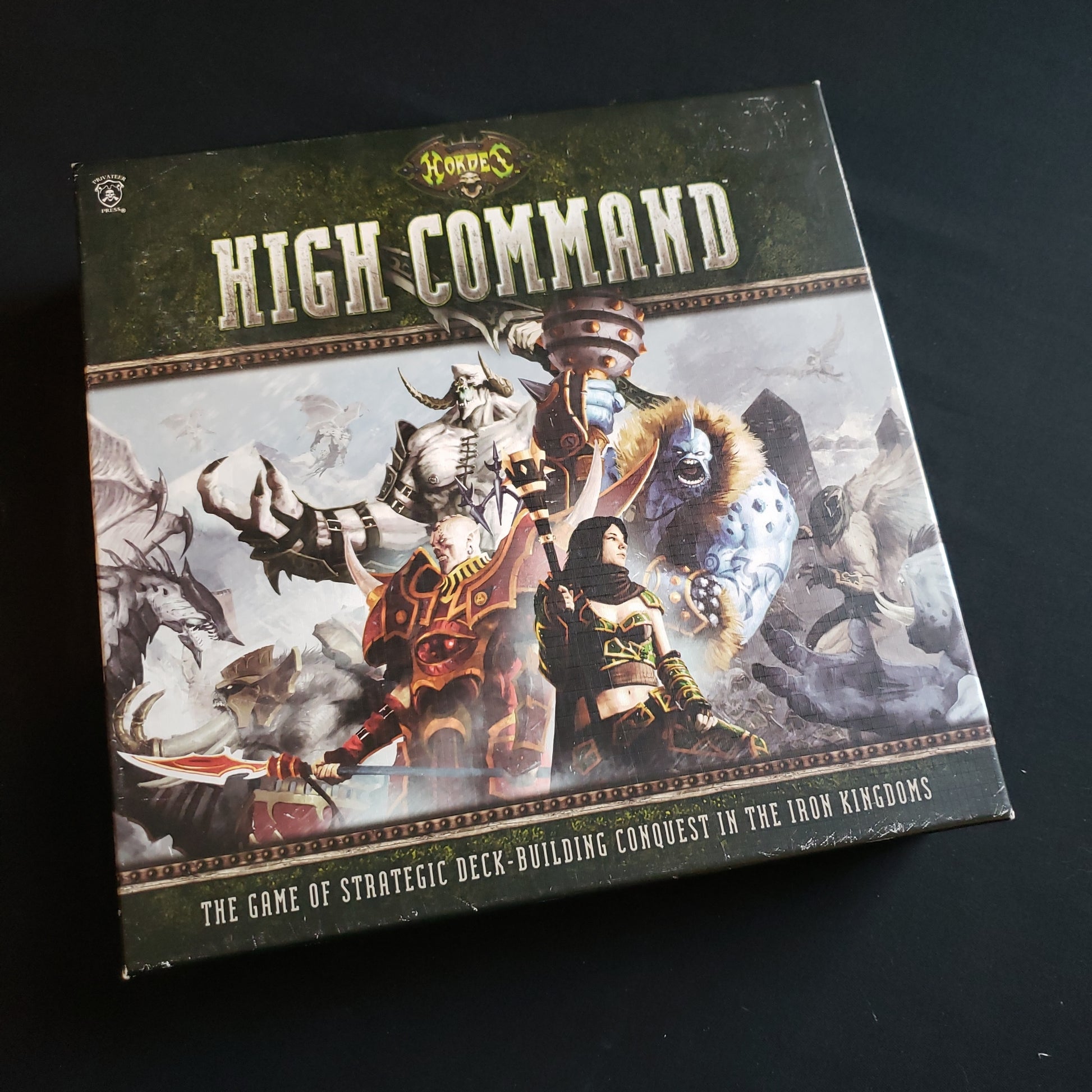 Image shows the front cover of the box of the Hordes: High Command board game