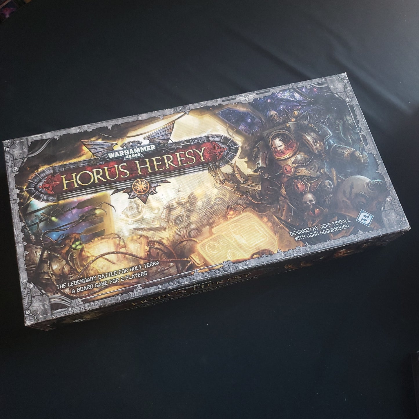 Image shows the front cover of the box of the Horus Heresy board game