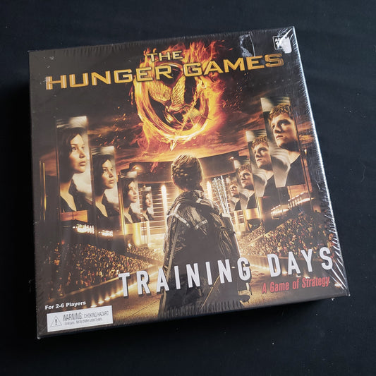 Image shows the front cover of the box of the Hunger Games: Training Days card game