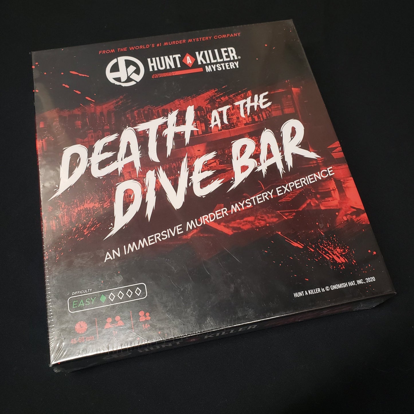 Image shows the front cover of the box of the Hunt A Killer: Death at the Dive Bar mystery game