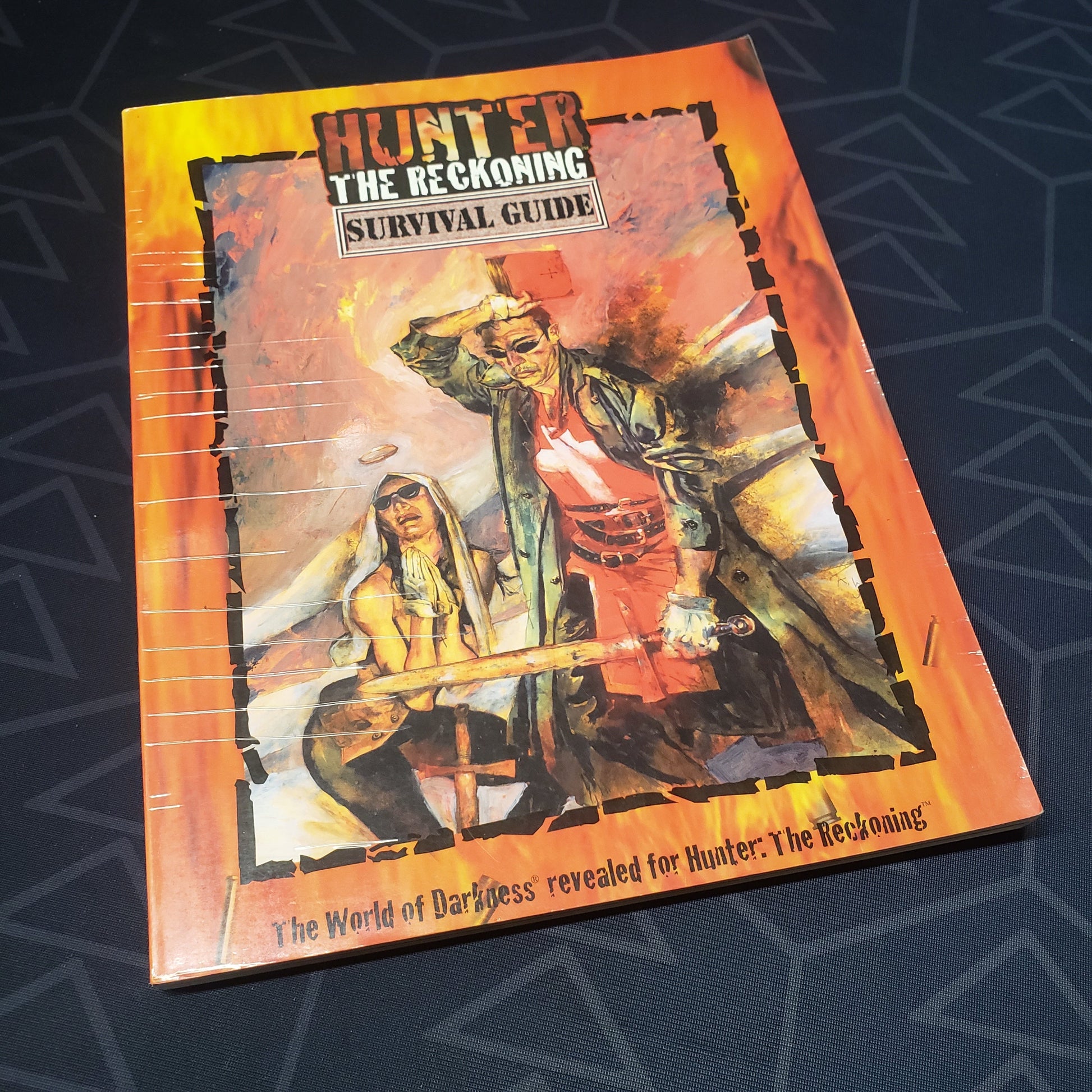 Image shows the front cover of the Survival Guide book for the roleplaying game Hunter: The Reckoning