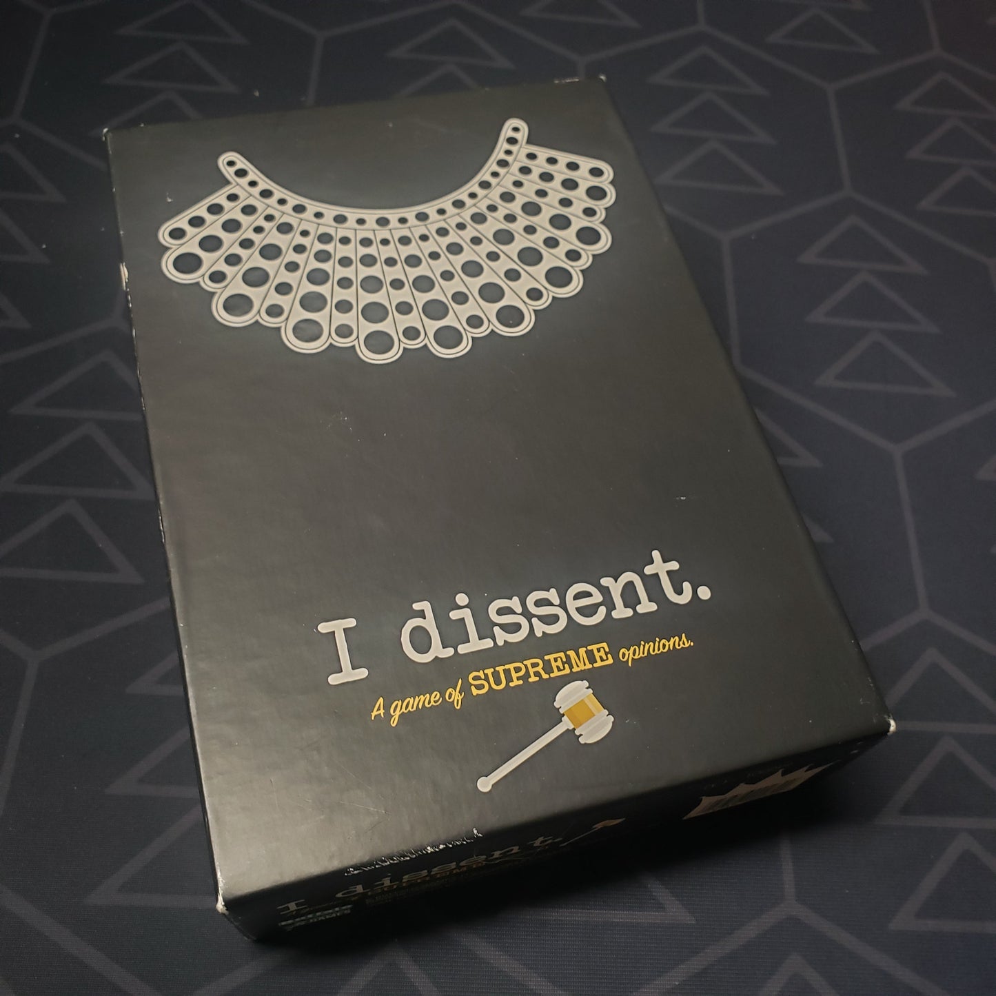 Image shows the front cover of the box for the I Dissent board game