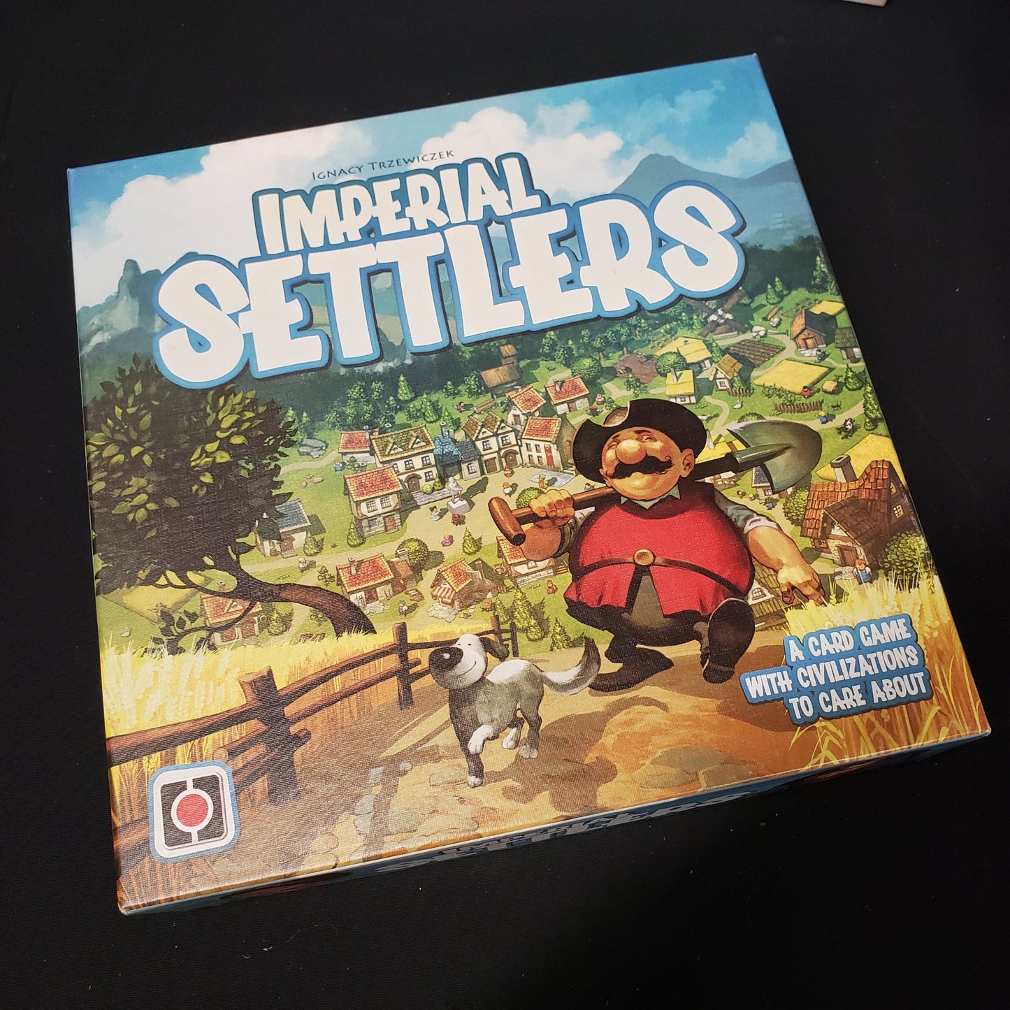 Image shows the front cover of the box of the Imperial Settlers card game