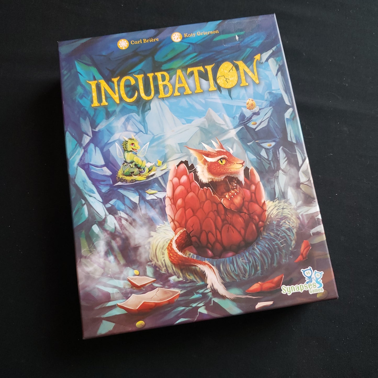 Image shows the front cover of the box of the Incubation board game