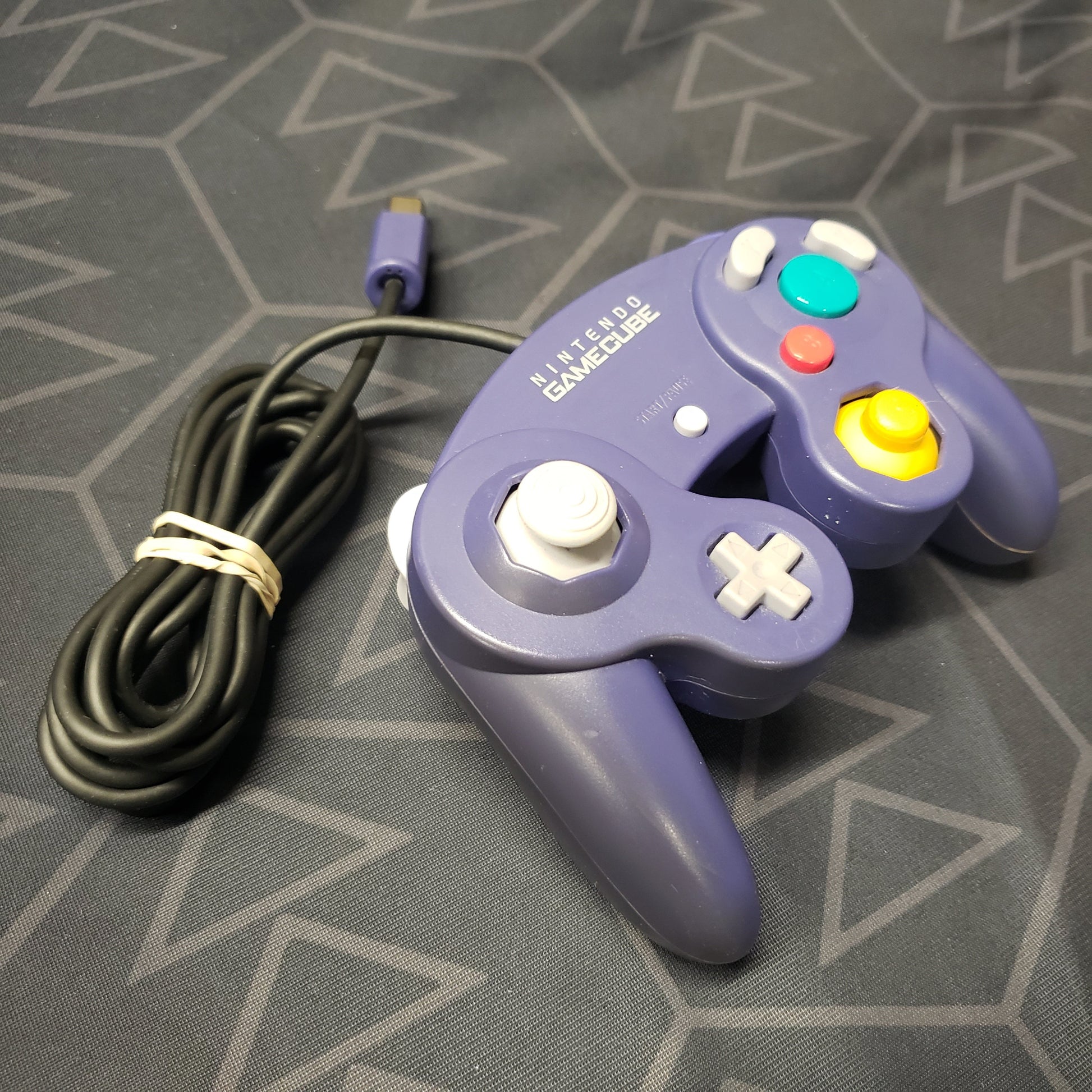 Image shows an Indigo color gaming controller for the GameCube