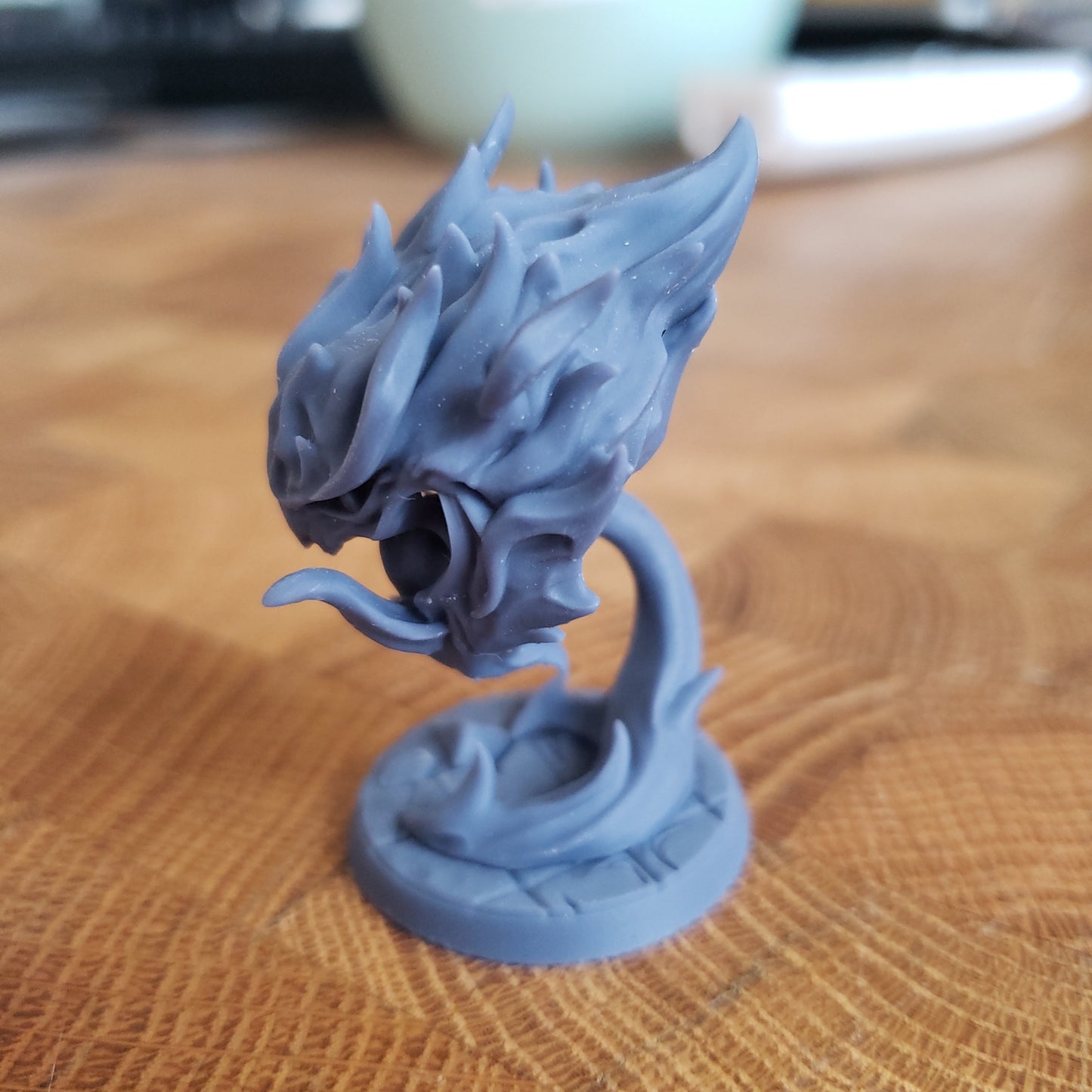 Image shows an example of a 3D printed fire elemental gaming miniature printed in-house at All Systems Go