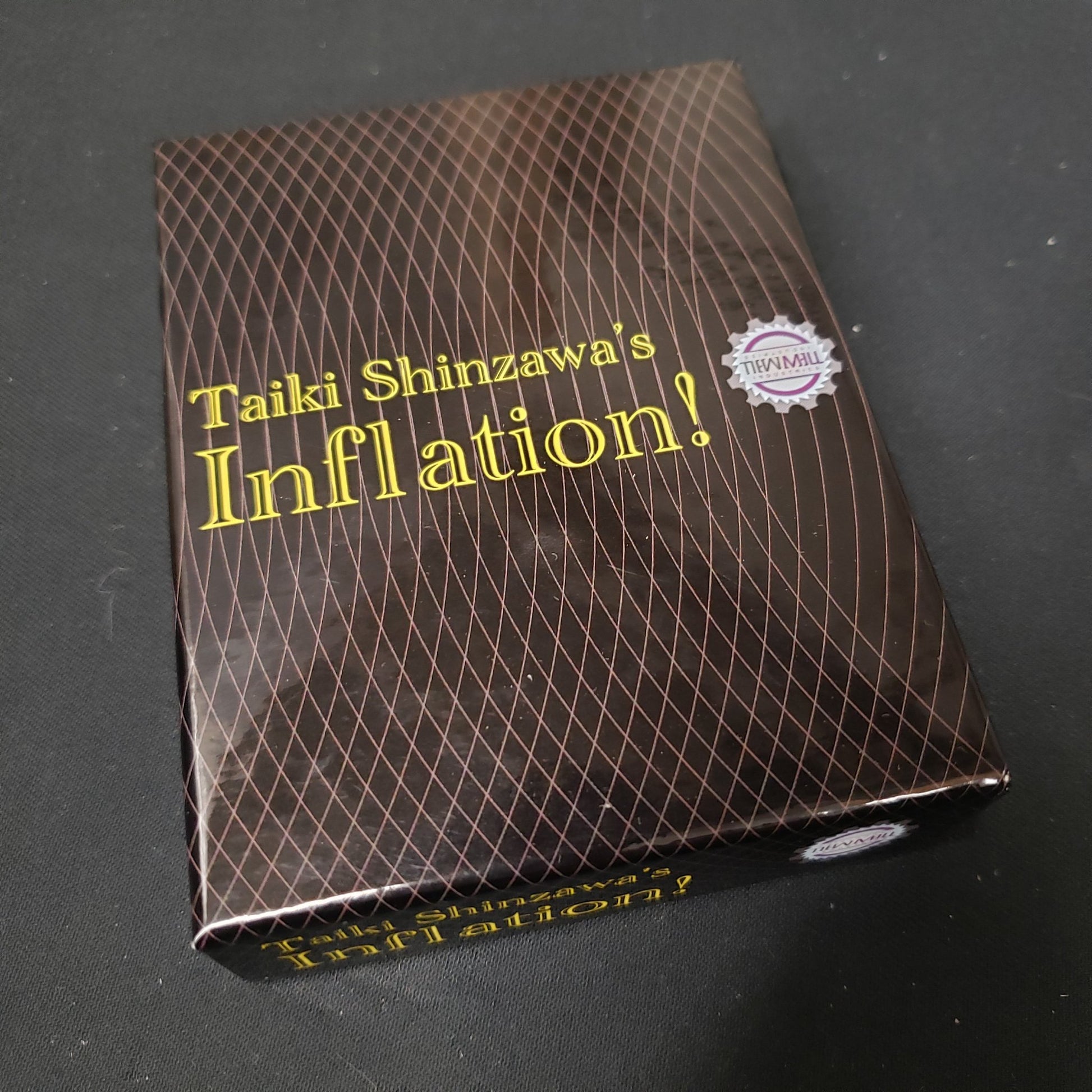Image shows the front cover of the box of the Inflation! card game