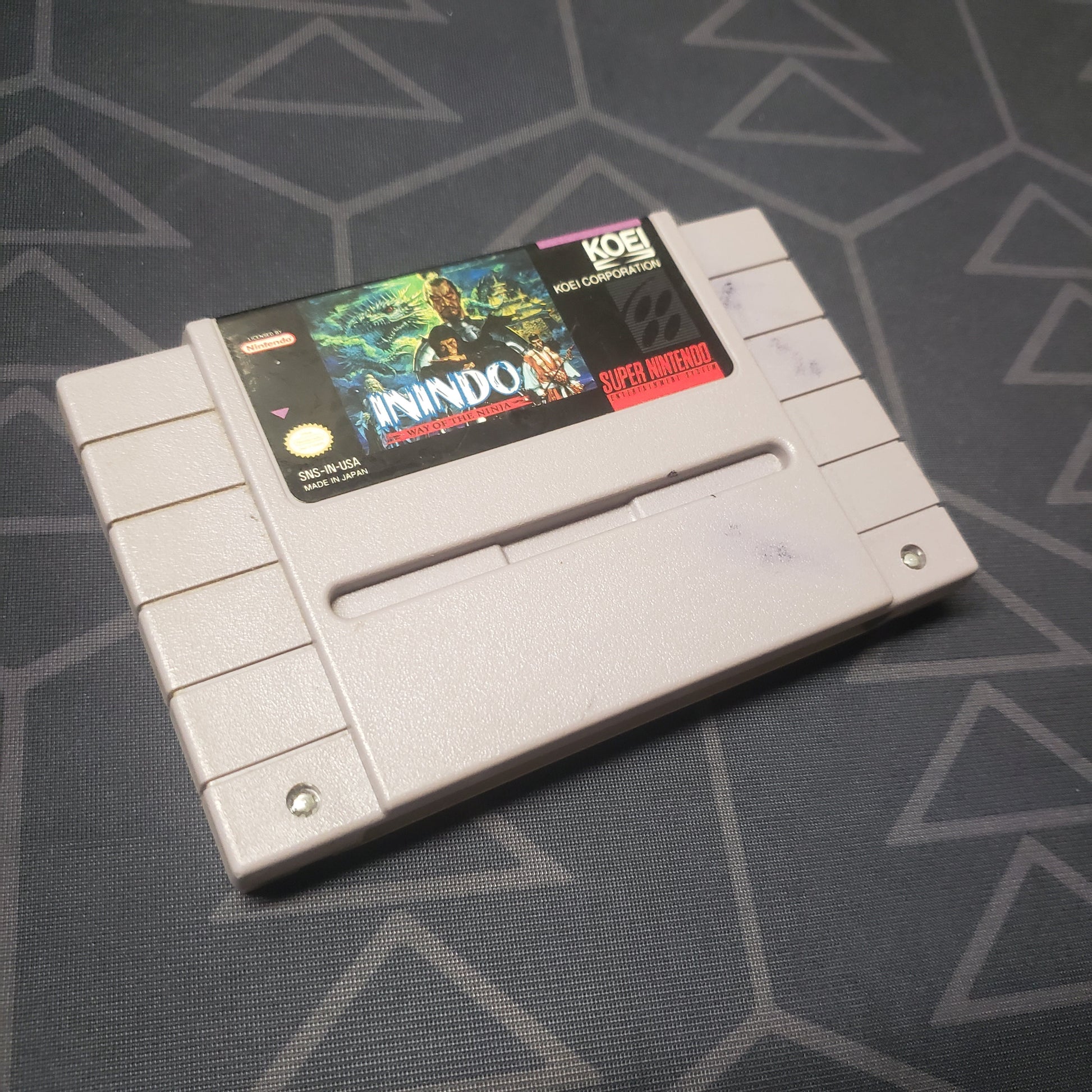 Image shows the front of the cartridge for the video game Inindo: Way of the Ninja for the Super Nintendo