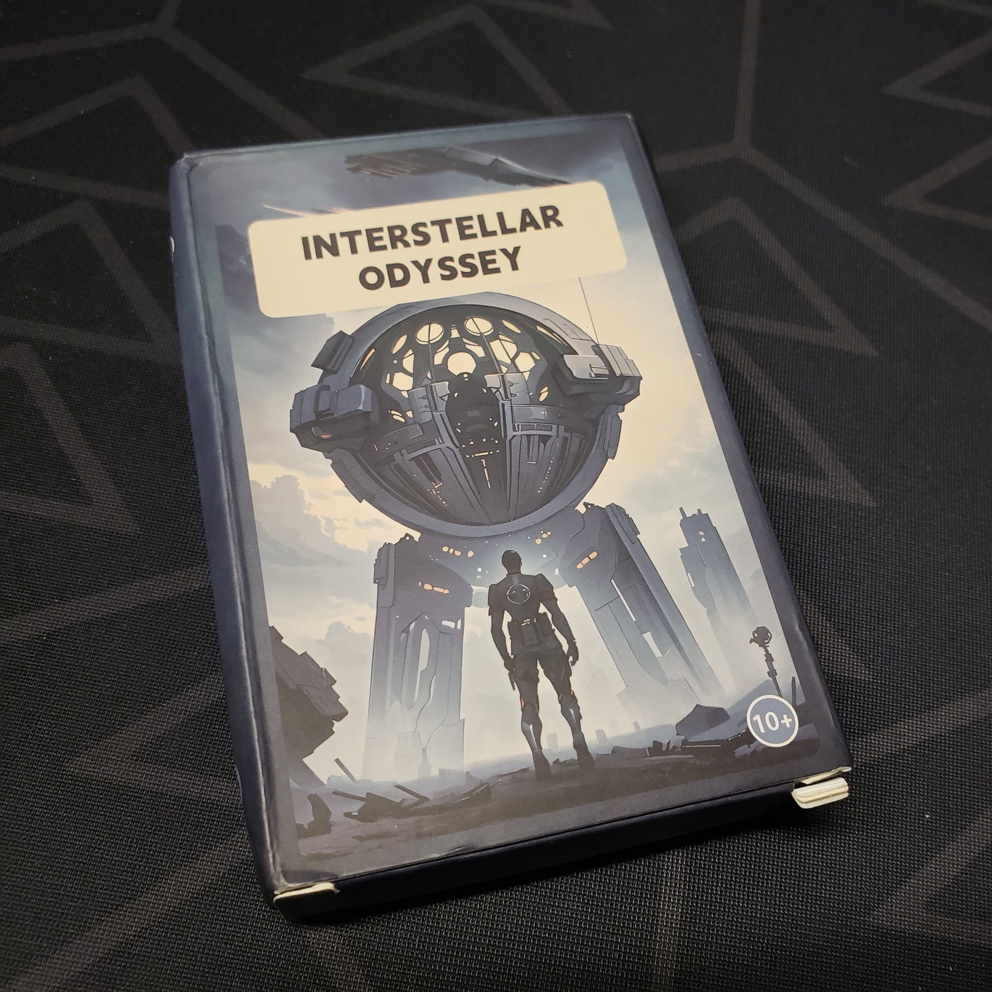 Image shows the front cover of the box for the Interstellar Odyssey board game