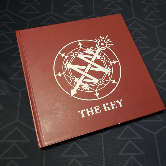 Image shows the front cover of the book The Key for the roleplaying game Invisible Sun