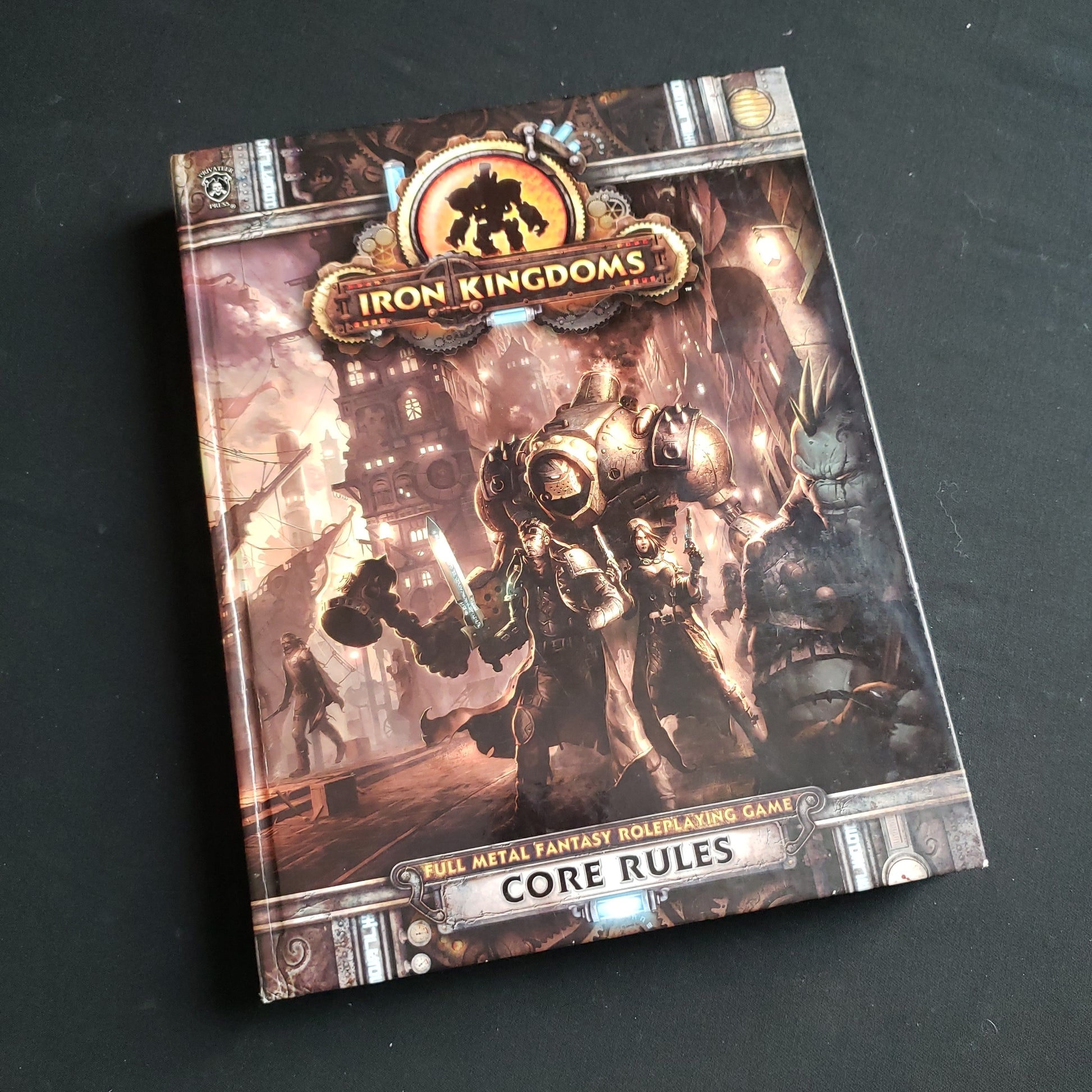 Image shows the front cover of the Core Rulebook for the Iron Kingdoms roleplaying game