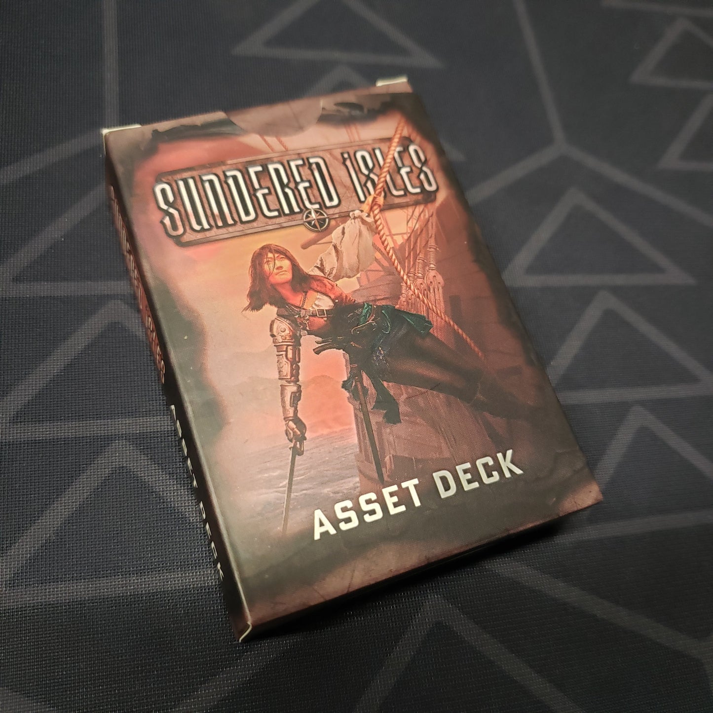 Image shows the front cover of the Sundered Isles: Asset Deck box for the roleplaying game Ironsworn: Starforged