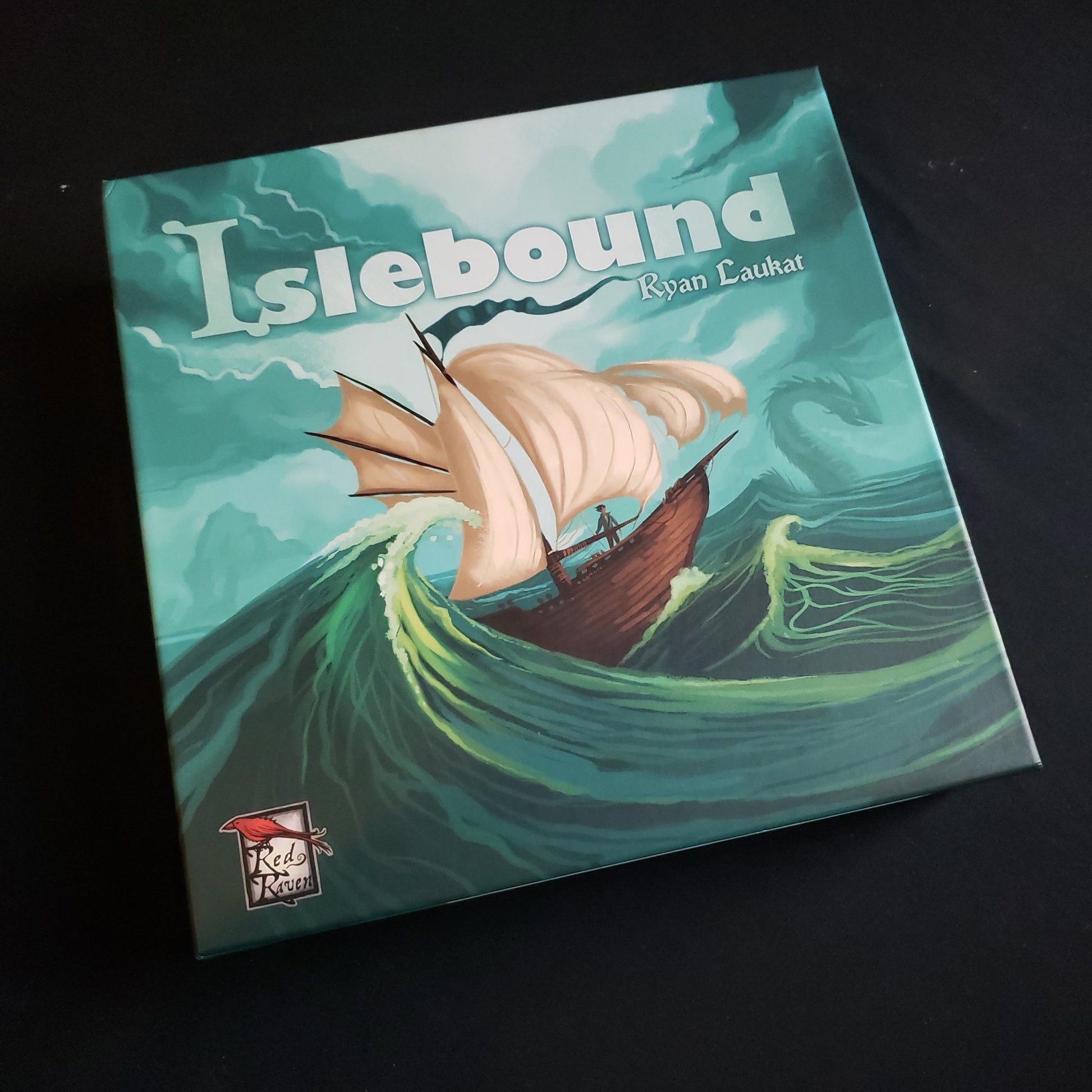 Image shows the front cover of the box of the Islebound board game